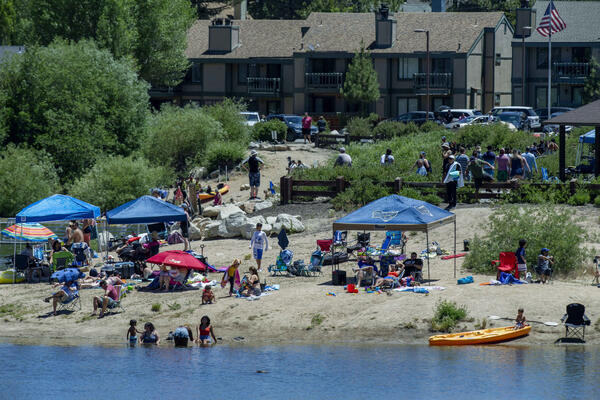 People fill the shores of Boulder Bay Park to cool...