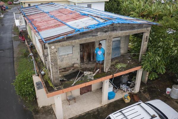 Jetsabel Osorio stands in her house damaged five years ago...