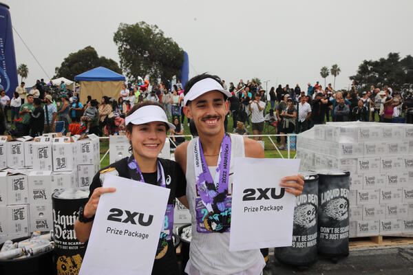 The top female finisher, Margaux Curcuru of Rosamond, and the...