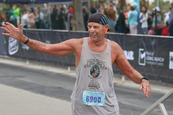 Legacy runner, Tom Frost, 69, crosses the finish on Sunday,...