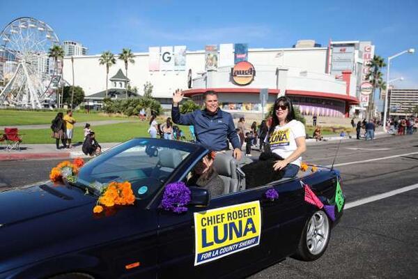 Former Long Beach police chief and current candidate for LA County sheriff Robert Luna waves during a parade down Pine Avenue on Saturday, Nov. 5, 2022, kicking off the Día de los Muertos celebration downtown Long Beach.  (Photo by Howard Freshman, Contributing Photographer)