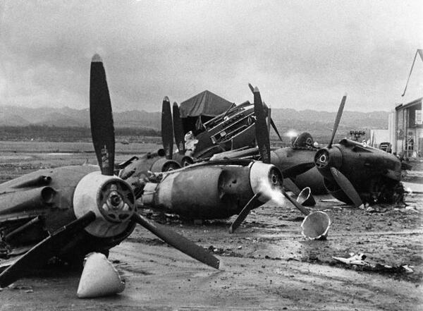The shattered wreckage of American planes bombed by the Japanese in their attack on Pearl Harbor is strewn on Hickam Field, Dec. 7, 1941. (AP Photo)