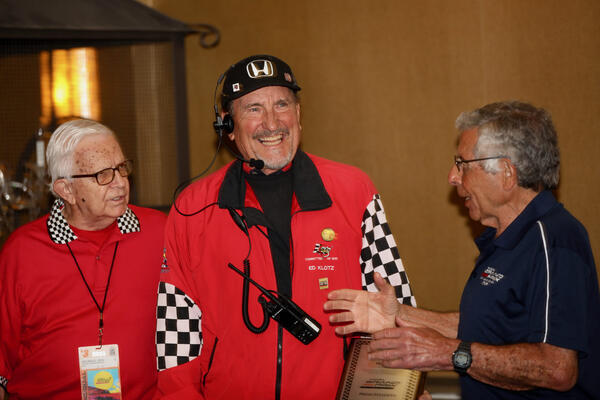Longtime volunteer Ed Klotz, center, is announced as this year’s...