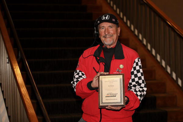 Longtime volunteer Ed Klotz displays his Allen Wolfe Spirit Award...