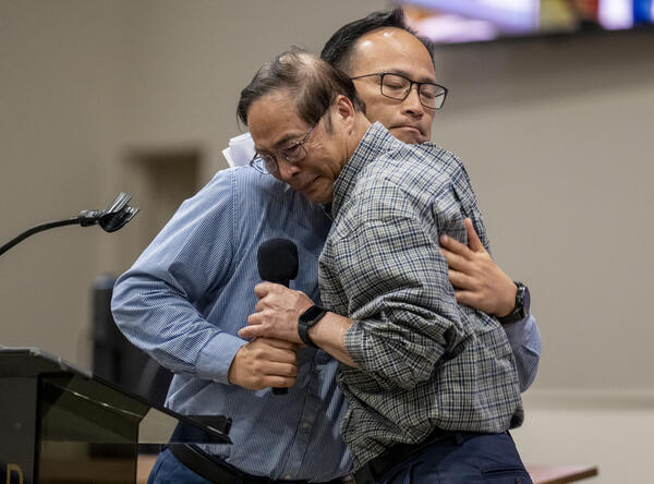 Pastor Billy Chang, front, who was at the Taiwanese Presbyterian...
