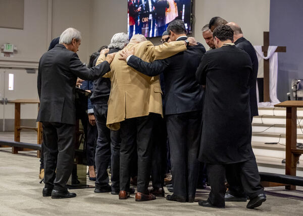 Faith and civic leaders prayed over Pastor Billy Chang, who...