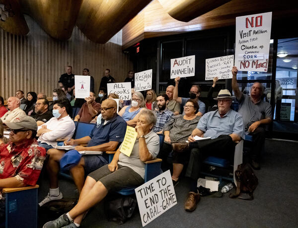 Anaheim residents protest during a Anaheim City Council meeting in...