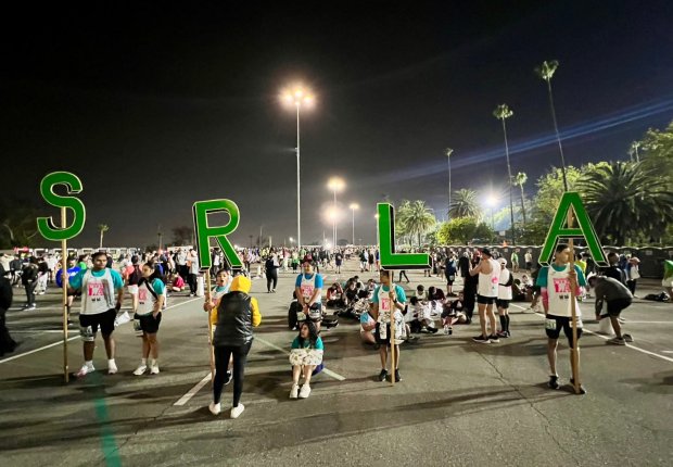 Runners from Students Run L.A. gather before the start of the 39th annual L.A. Marathon, March 17, 2024 (Photo by Dean Musgrove)